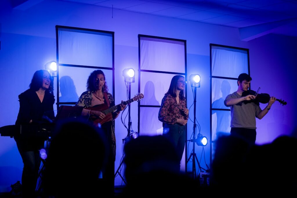 Musicians performing onstage, an illustrative photograph rather than Mela Guitar Quartet